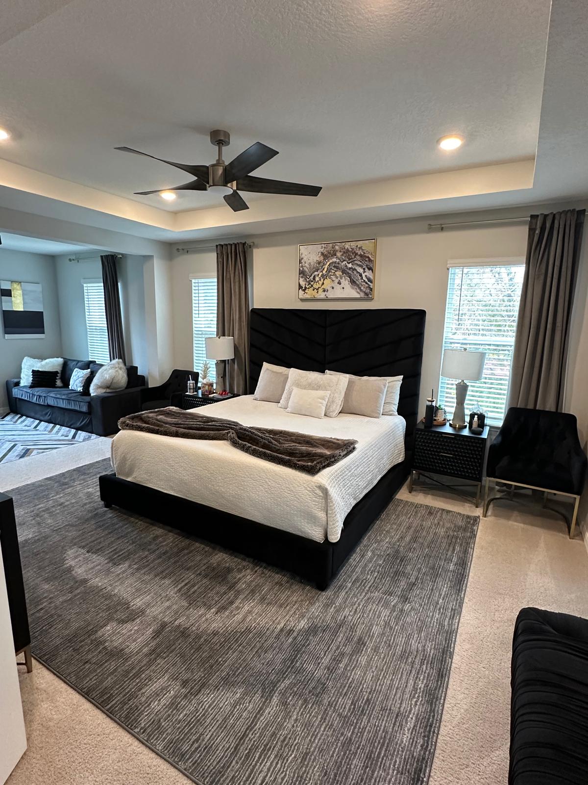 Pristine master bedroom with perfectly made bed after deep cleaning service in St Petersburg Florida